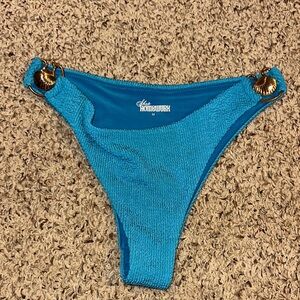 NWOT Shop Homewurk size medium teal bikini with gold shell emblem
